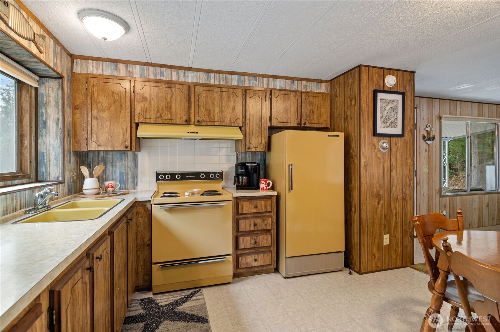 71 Bald Point Court Tahuya, WA 98588 - Photo 10 of 32 a kitchen with a refrigerator a stove a sink dishwasher and cabinets with wooden floor
