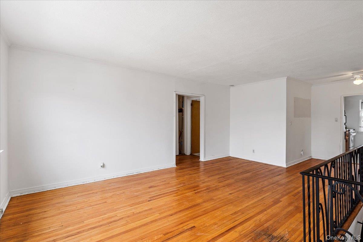 87-24 Marengo Street, Unit 2B Queens, NY 11423 - Photo 12 of 22 a view of an empty room and wooden floor