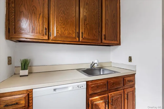 a kitchen with stainless steel appliances granite countertop a sink and cabinets