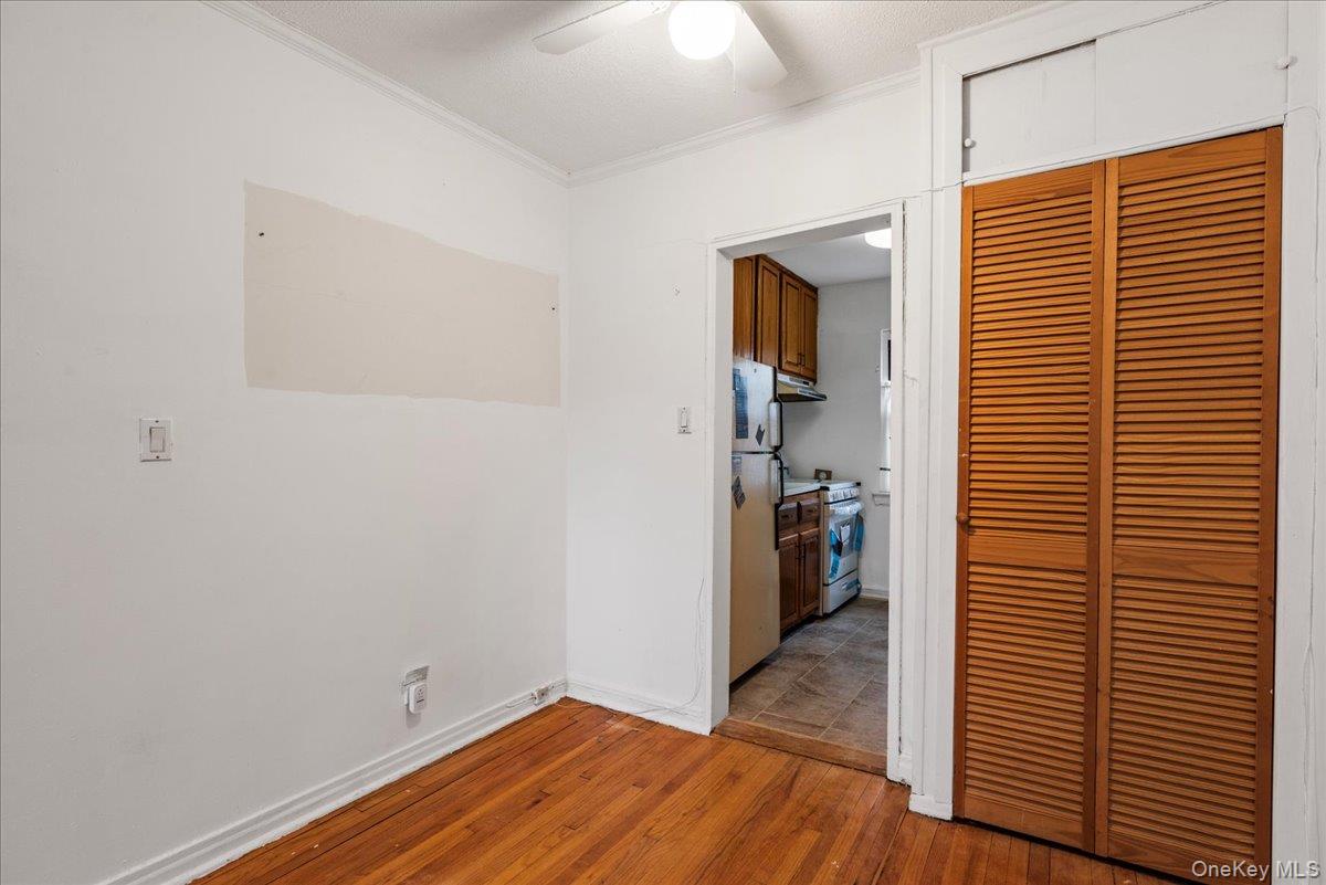 87-24 Marengo Street, Unit 2B Queens, NY 11423 - Photo 5 of 22 a view of a livingroom with wooden floor and closet