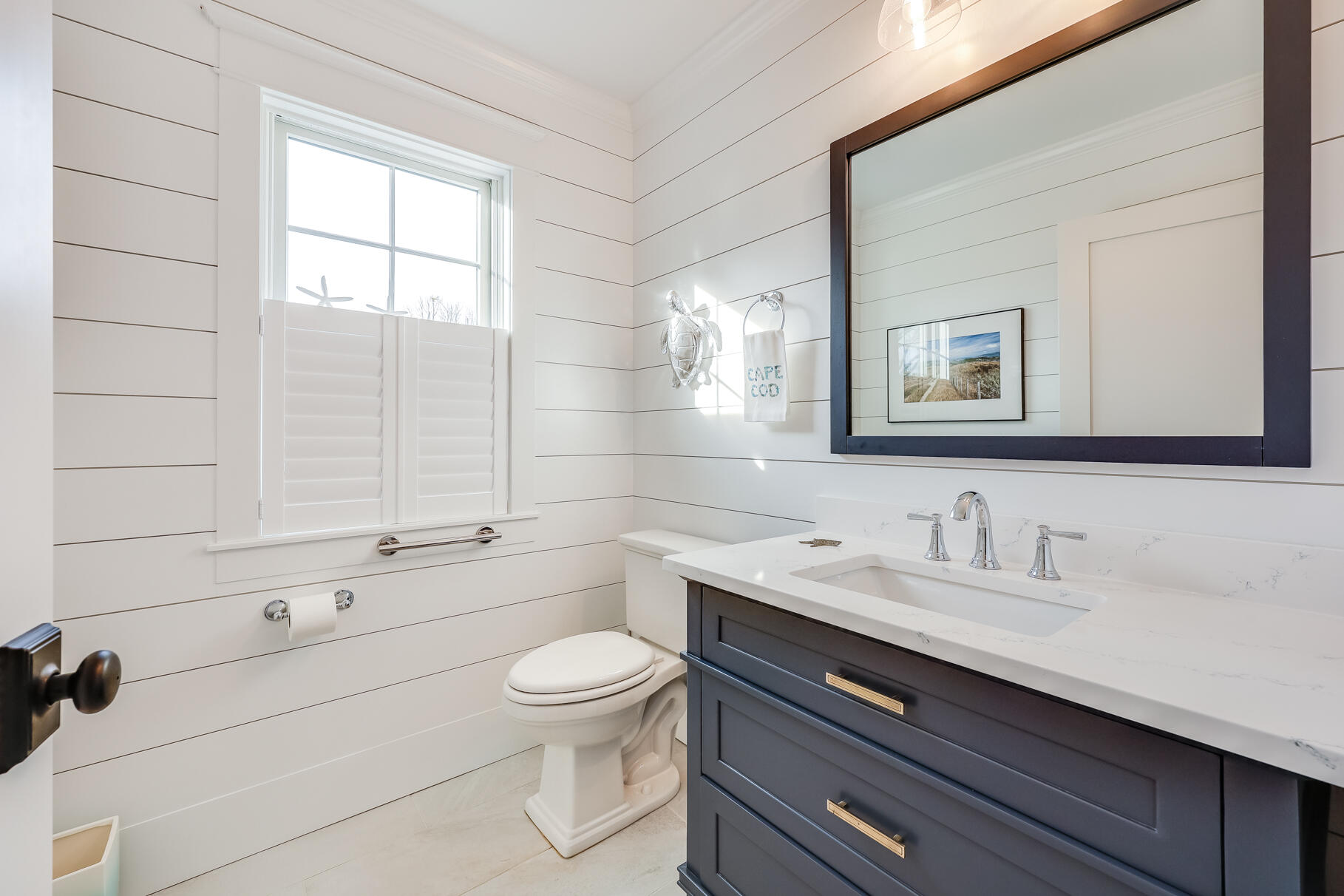 20 Cockle Cove Road South Chatham, MA 02659 - Photo 20 of 42 a bathroom with a toilet a sink a vanity and mirror