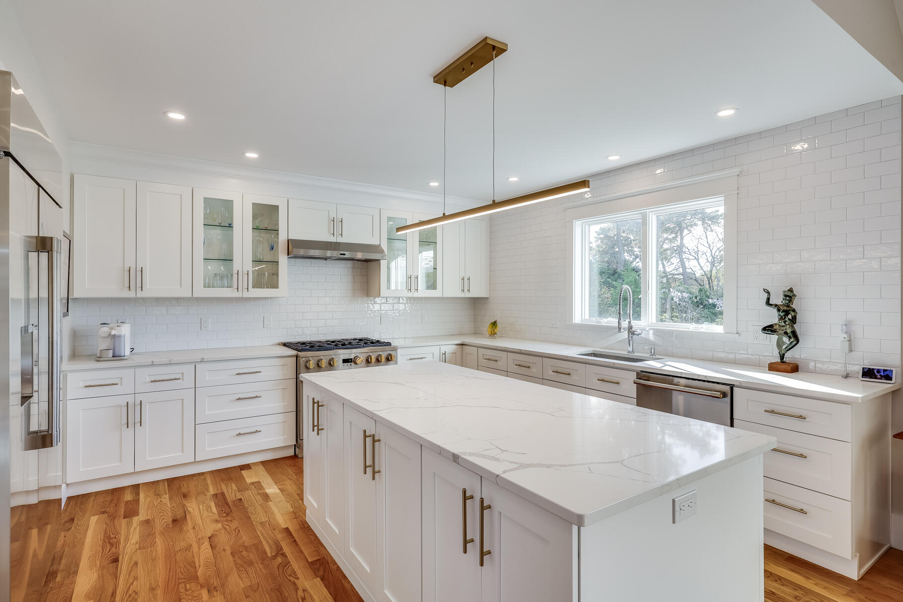 20 Cockle Cove Road South Chatham, MA 02659 - Photo 4 of 42 a kitchen with a sink stove and cabinets