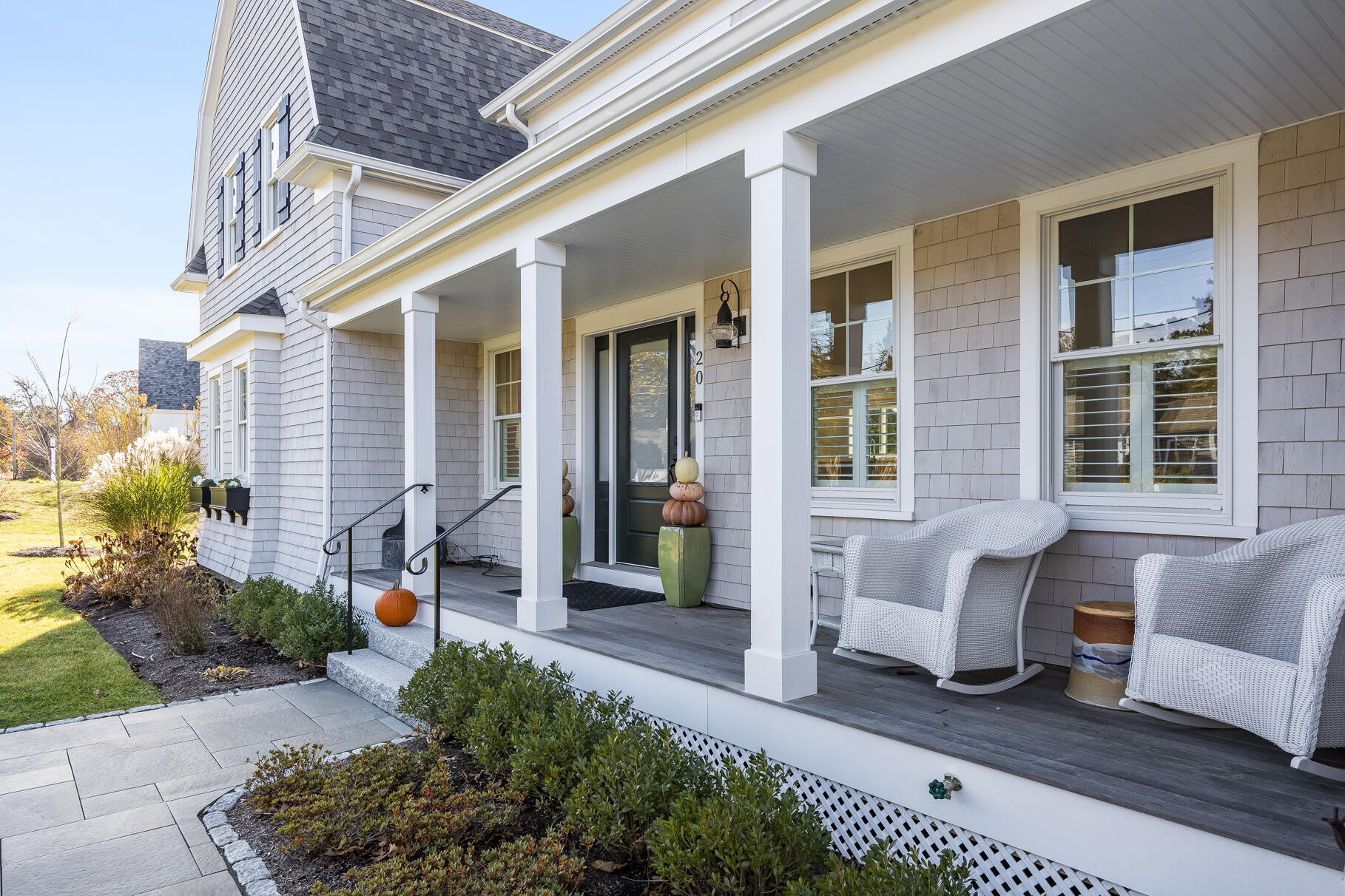 20 Cockle Cove Road South Chatham, MA 02659 - Photo 6 of 42 a front view of a house with outdoor seating and a potted plant