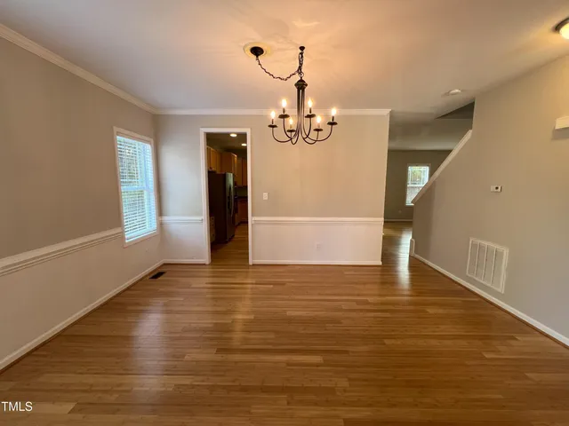 a view of a livingroom with wooden floor