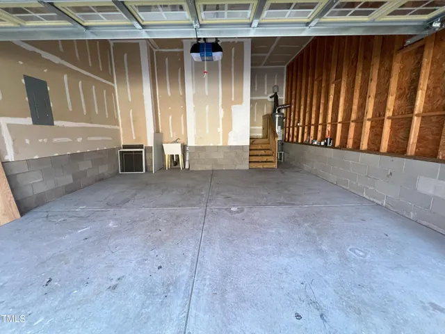 a view of an empty room with a fireplace