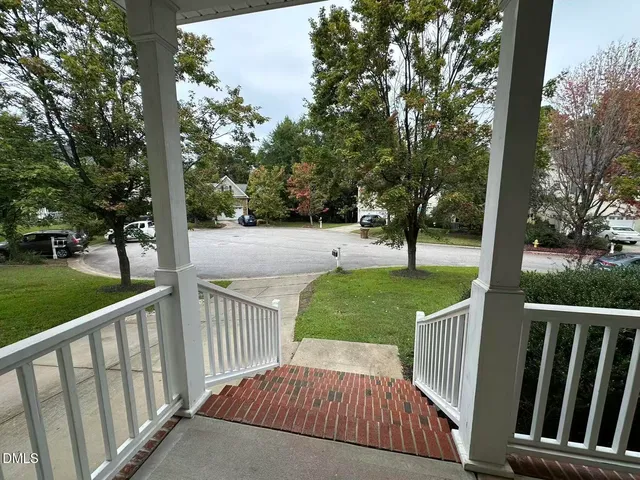 a view of a deck with a yard