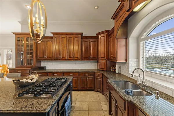 $999,000 | 2421 Northeast Lake Breeze Drive, Lee's Summit, MO 64086