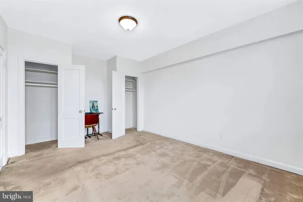 a view of a room with furniture and a window