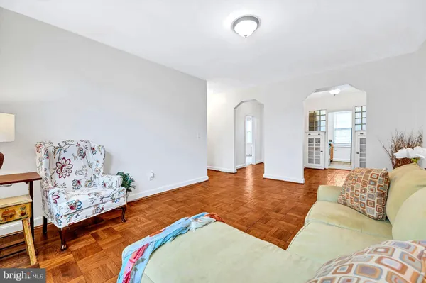 a bedroom with furniture and painting on the wall