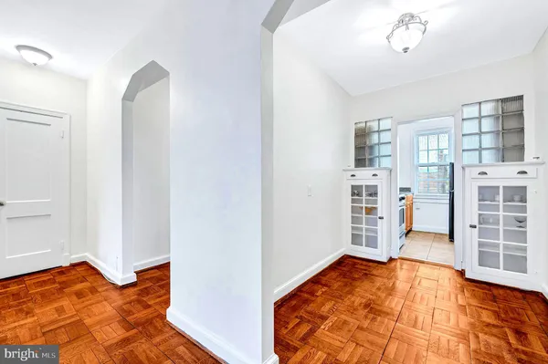 a view of a bedroom with furniture and closet