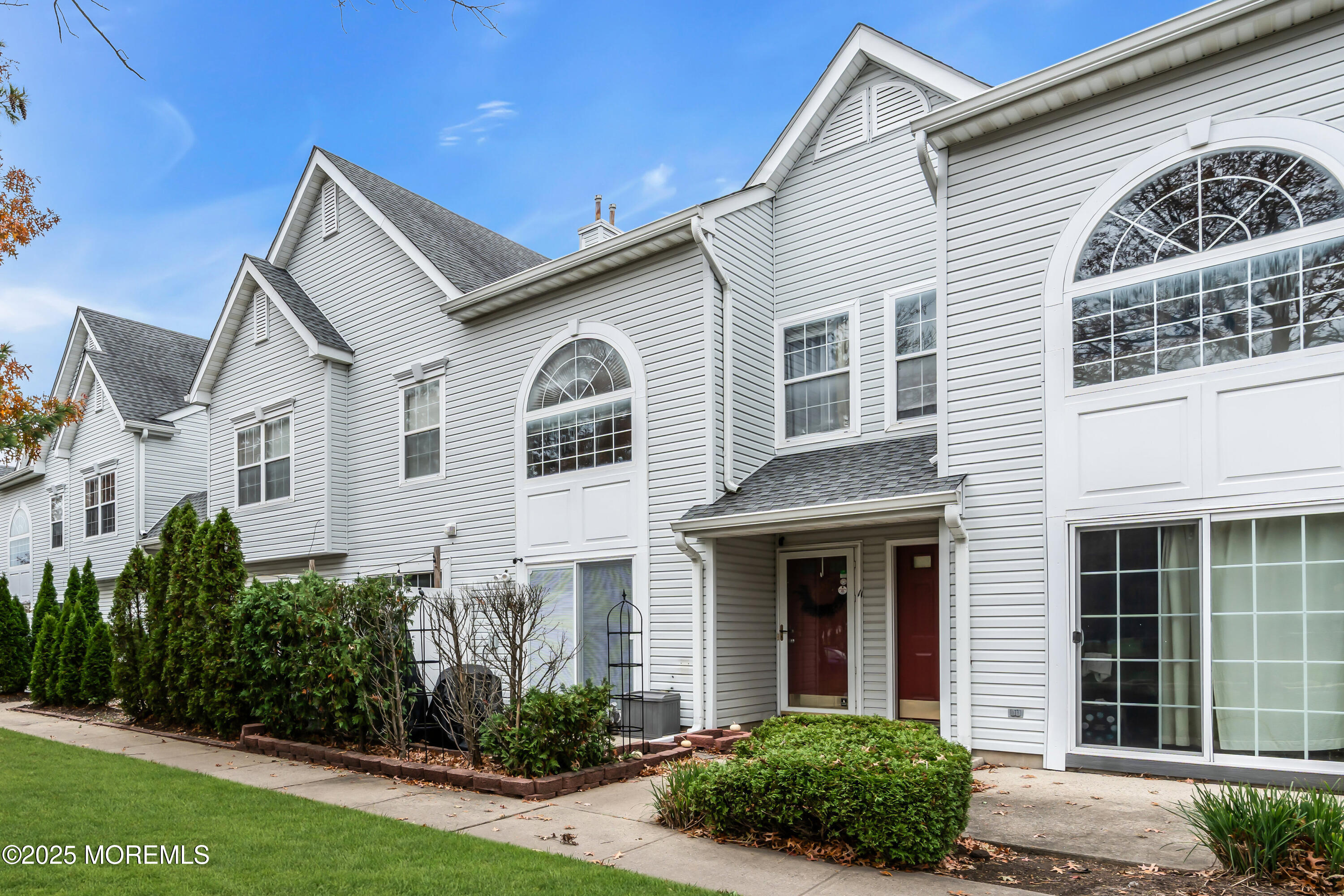 11 Madison Court Tinton Falls, NJ 07712 - Photo 1 of 24 a view of a white house next to a yard