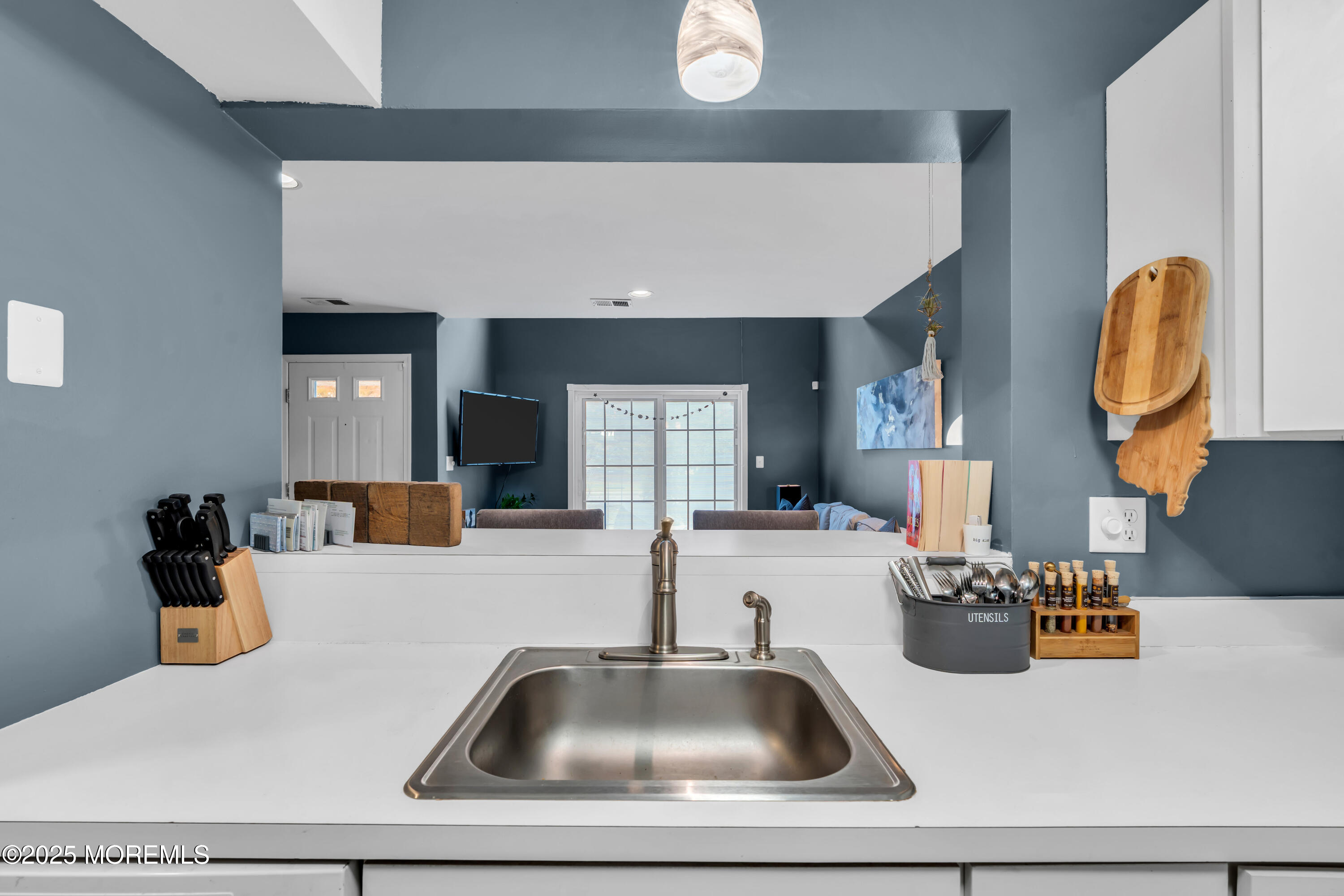11 Madison Court Tinton Falls, NJ 07712 - Photo 11 of 24 a kitchen with a sink a counter top space and cabinets