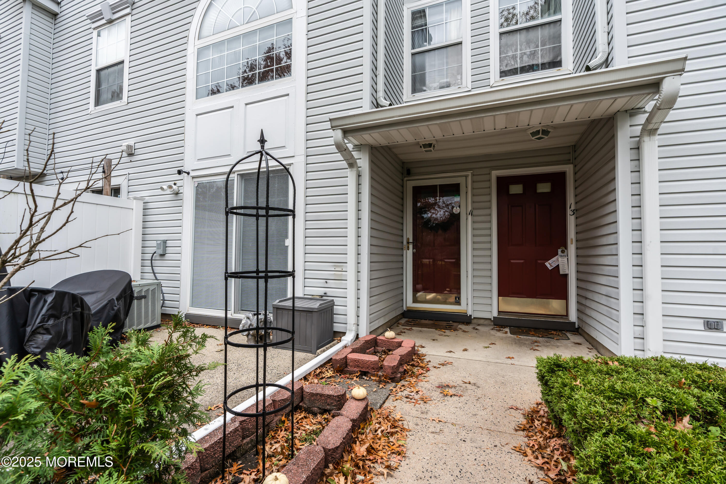 11 Madison Court Tinton Falls, NJ 07712 - Photo 2 of 24 a view of a front door of house with a tree