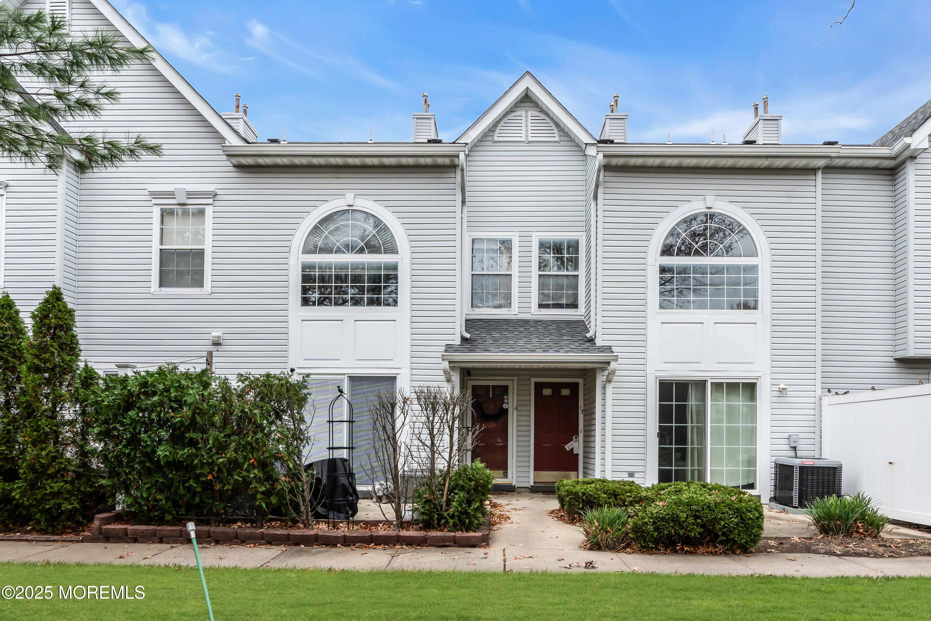 11 Madison Court Tinton Falls, NJ 07712 - Photo 22 of 24 a front view of a house with garden