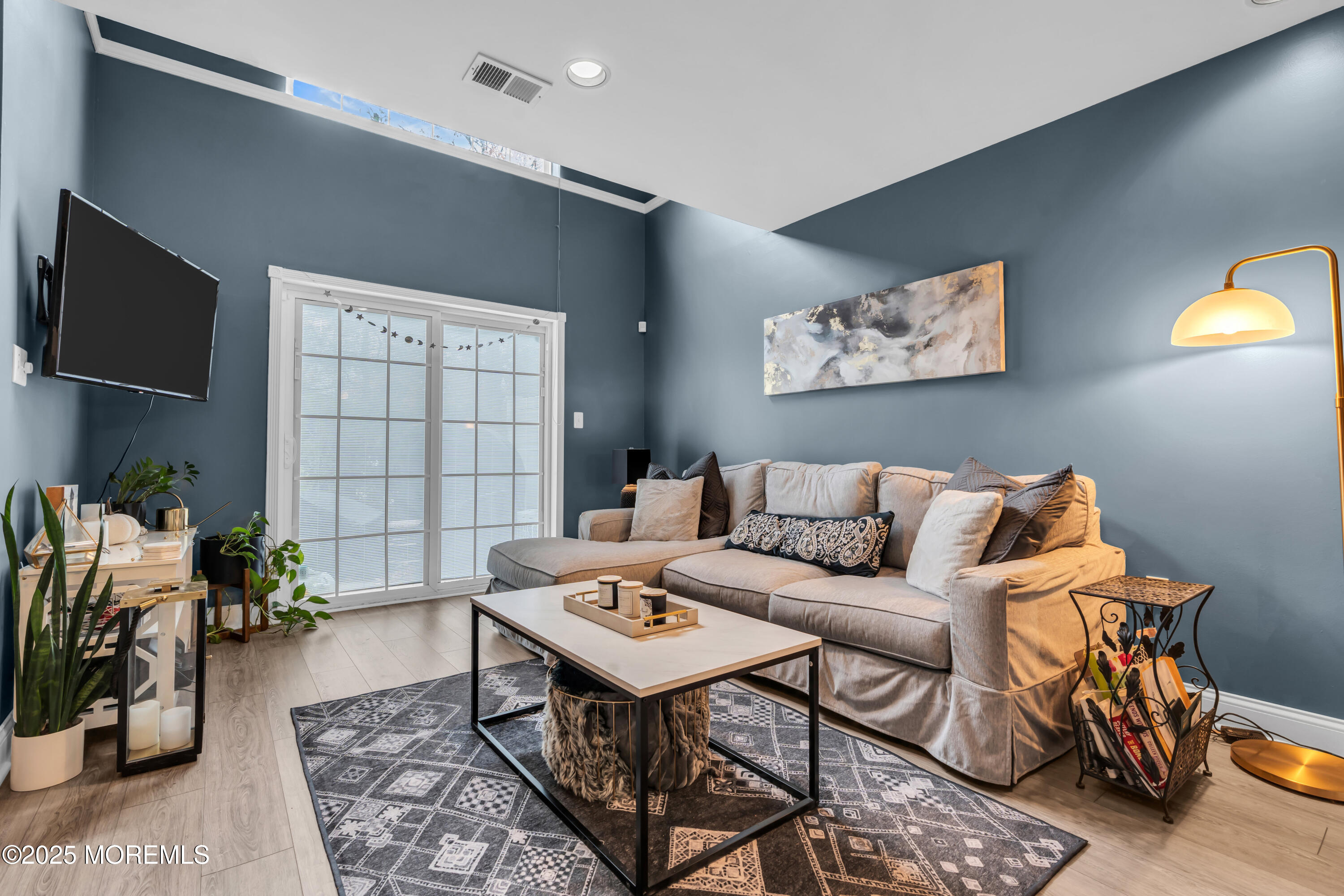 11 Madison Court Tinton Falls, NJ 07712 - Photo 5 of 24 a living room with furniture and a flat screen tv