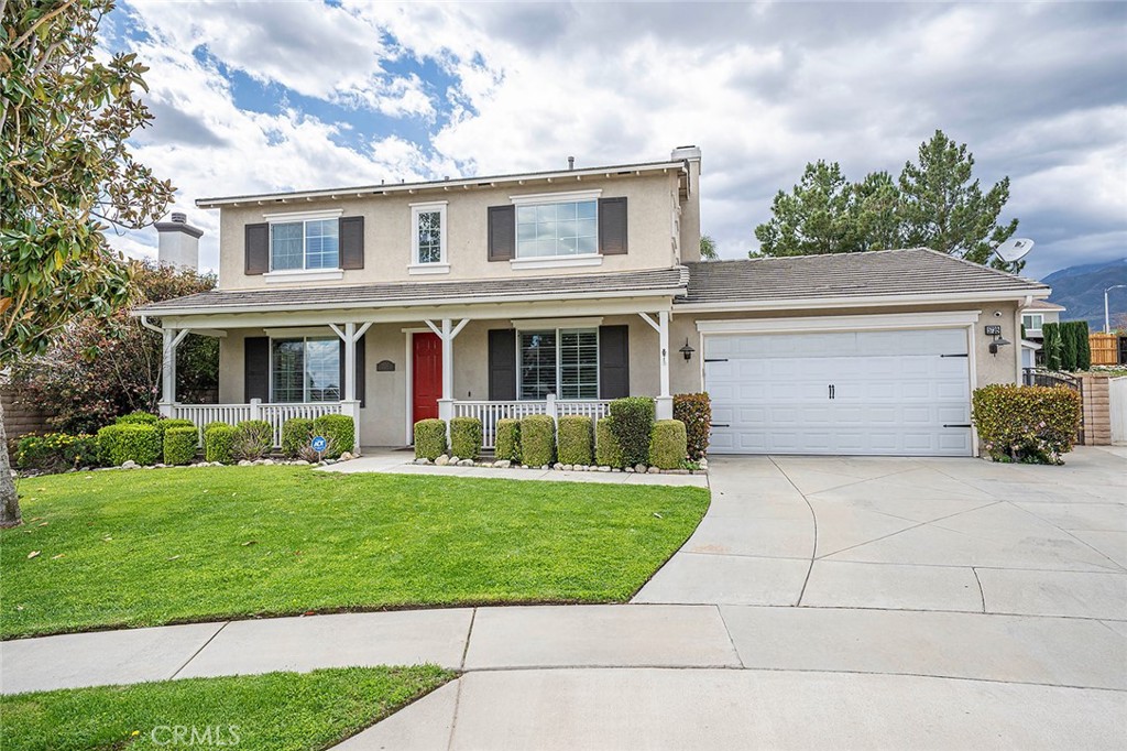 5732 Rose Croft Court Rancho Cucamonga, CA 91739 - Photo 1 of 1 a front view of a house with a yard and garage