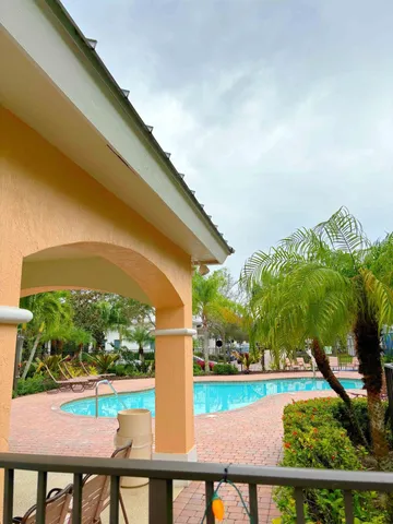 a view of swimming pool from a balcony