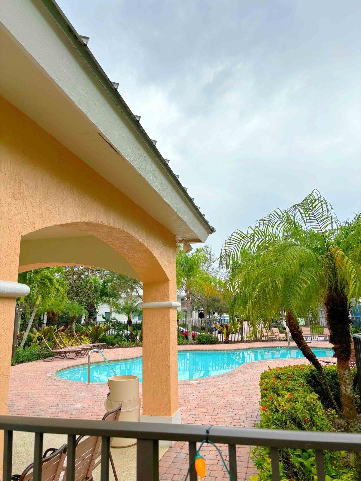 a view of swimming pool from a balcony