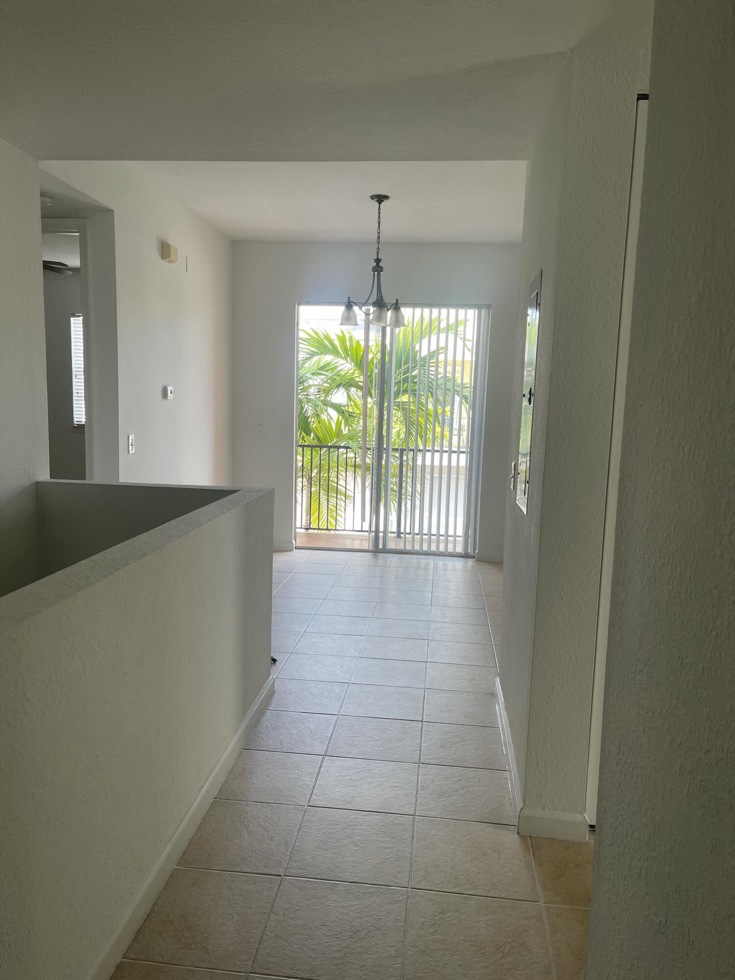 10440 Southwest Stephanie Way, Unit 211 Port St. Lucie, FL 34987 - Photo 13 of 13 a view of an empty room with a window