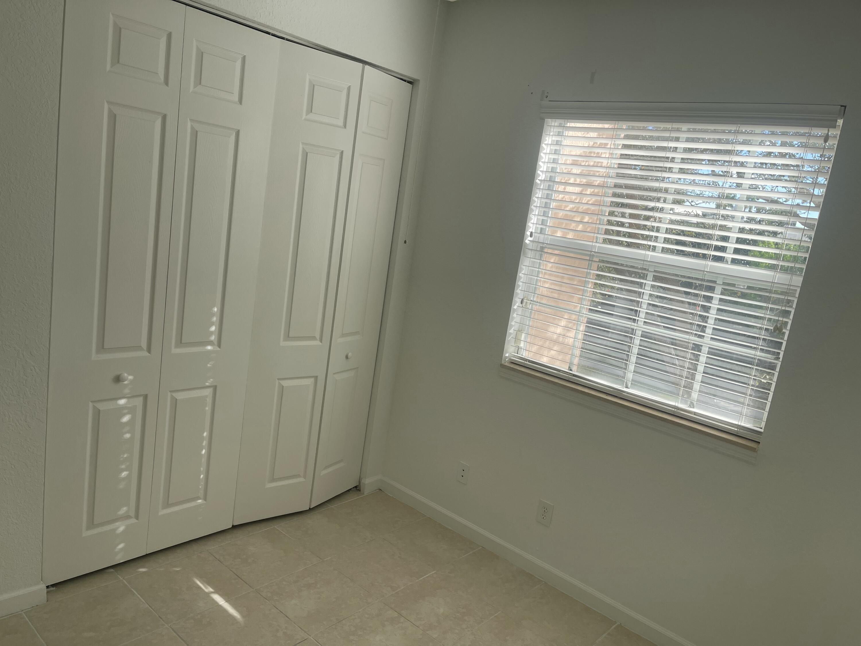 10440 Southwest Stephanie Way, Unit 211 Port St. Lucie, FL 34987 - Photo 9 of 13 a view of a small space with a window