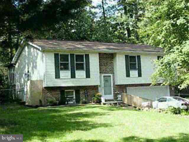 412 Rupp Road Gettysburg, PA 17325 - Photo 1 of 1 a view of a house with a yard patio and a garden