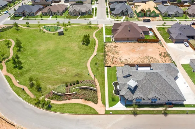 an aerial view of a house with a swimming pool