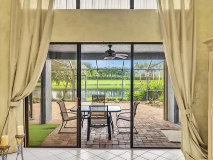 an aerial view of a residential houses with outdoor space and swimming pool