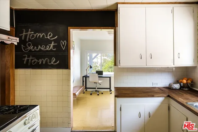 a bedroom with a bed and wall painting