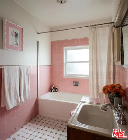 a view of a patio with table and chairs and potted plants