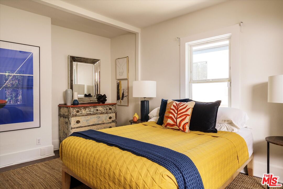 1741 Kent Street Los Angeles, CA 90026 - Photo 19 of 62 a bedroom with a bed and wooden floor