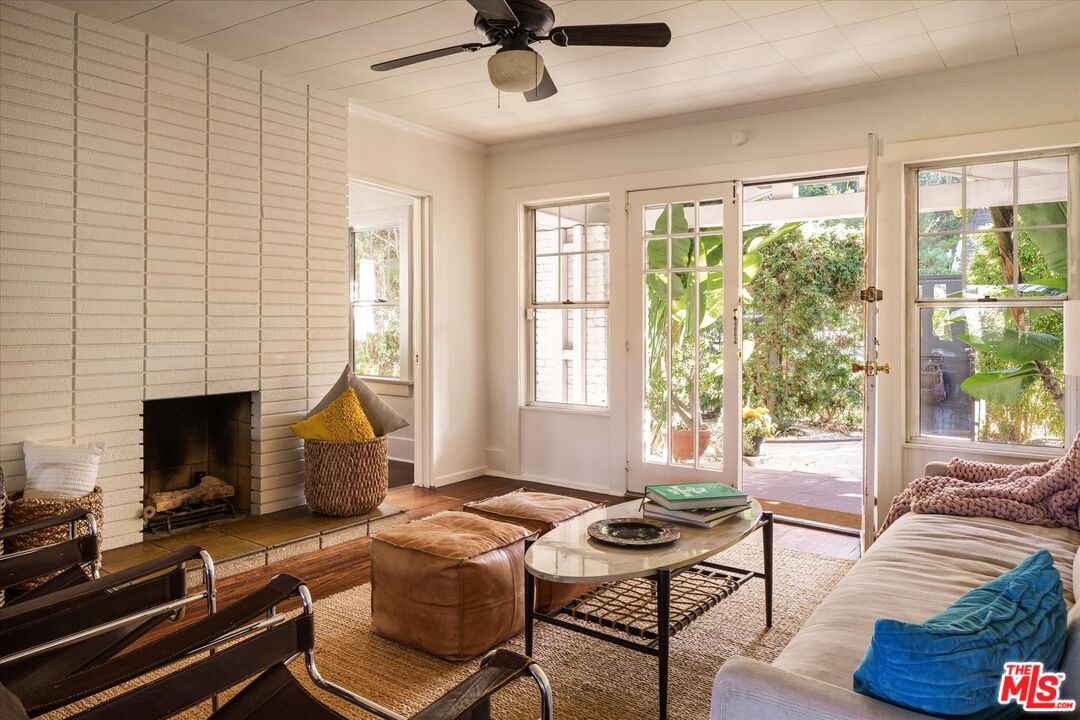 1741 Kent Street Los Angeles, CA 90026 - Photo 2 of 62 a living room with furniture fireplace and a flat screen tv