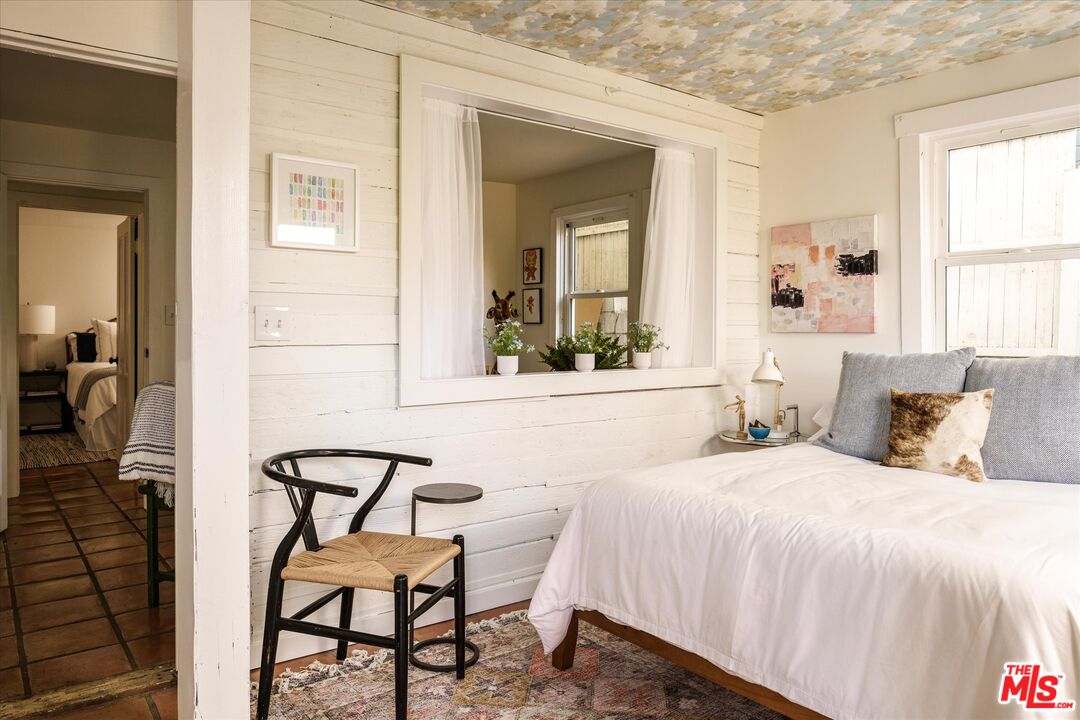 1741 Kent Street Los Angeles, CA 90026 - Photo 37 of 62 a bedroom with a bed and a chair