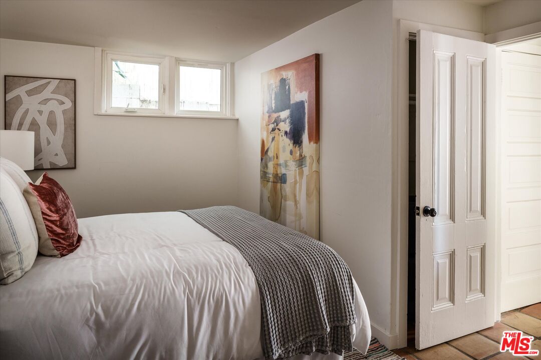 1741 Kent Street Los Angeles, CA 90026 - Photo 43 of 62 a bedroom with a bed and a window