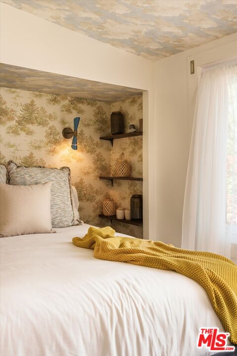 1741 Kent Street Los Angeles, CA 90026 - Photo 47 of 62 a bedroom with a bed and wall painting