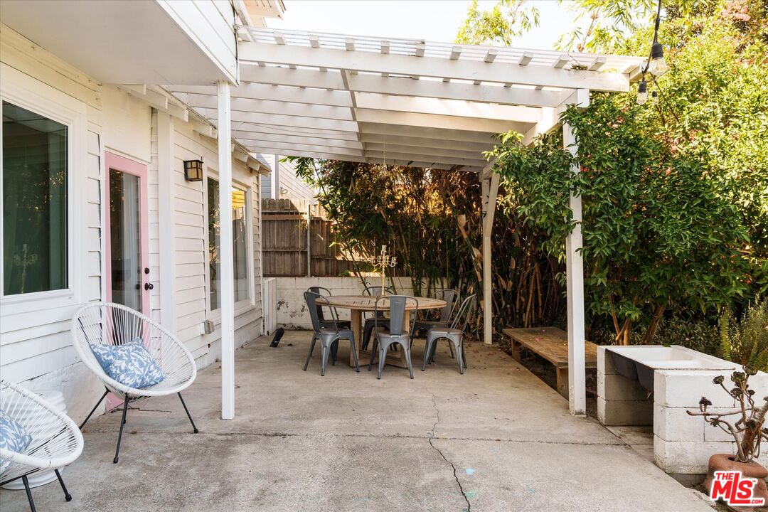 1741 Kent Street Los Angeles, CA 90026 - Photo 51 of 62 a view of a patio with table and chairs and potted plants
