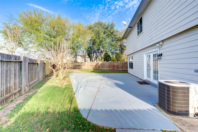 a view of a house with a yard covered in snow