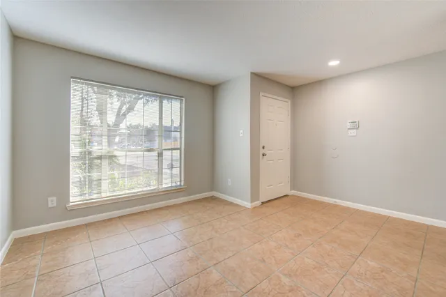 a view of an empty room with window