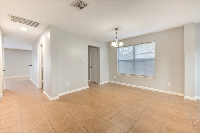 a kitchen with granite countertop a stove a sink and a microwave