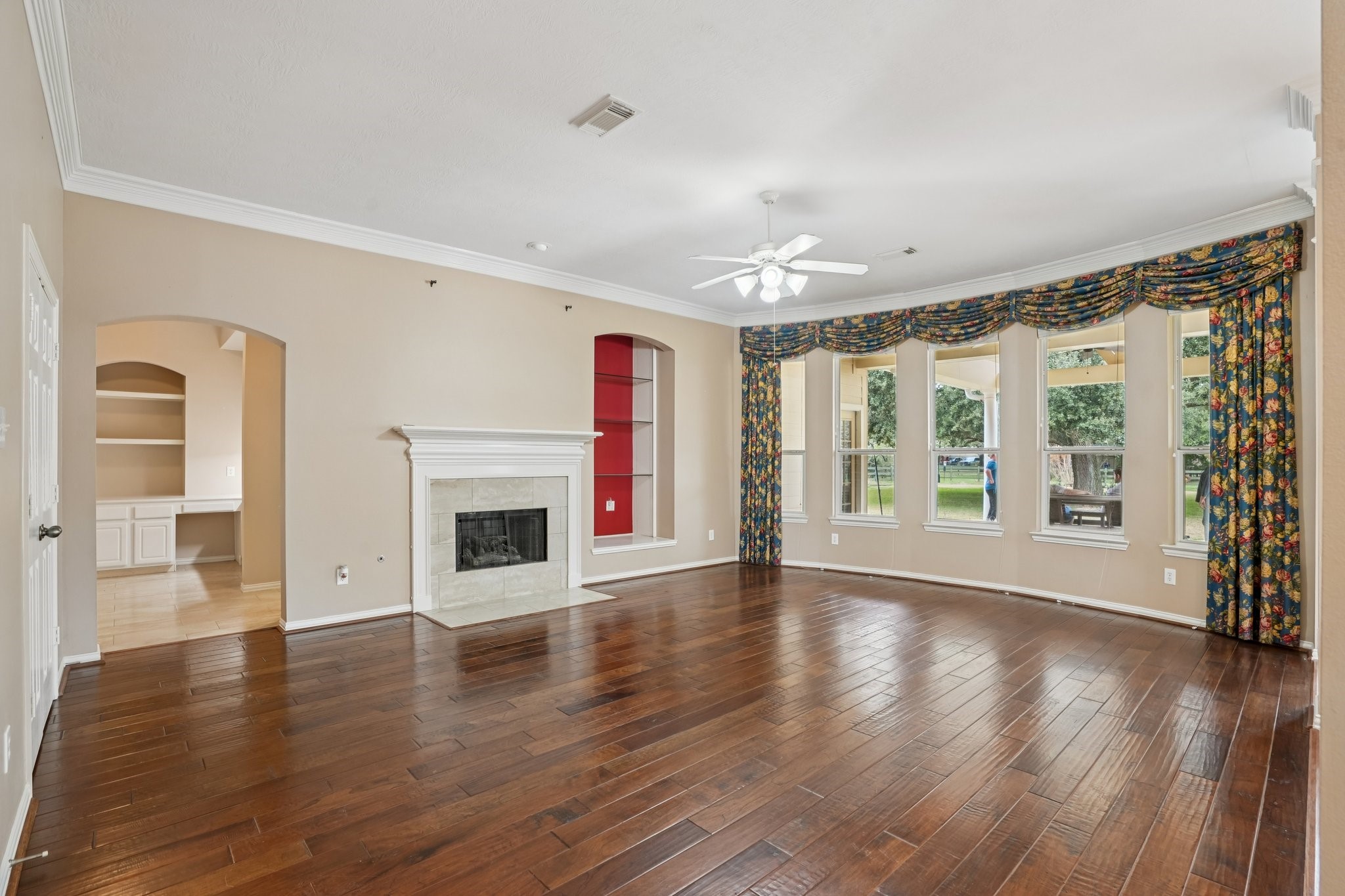 31810 Tree Farm Lane Fulshear, TX 77441 - Photo 14 of 48 a view of an empty room with glass door and wooden floor