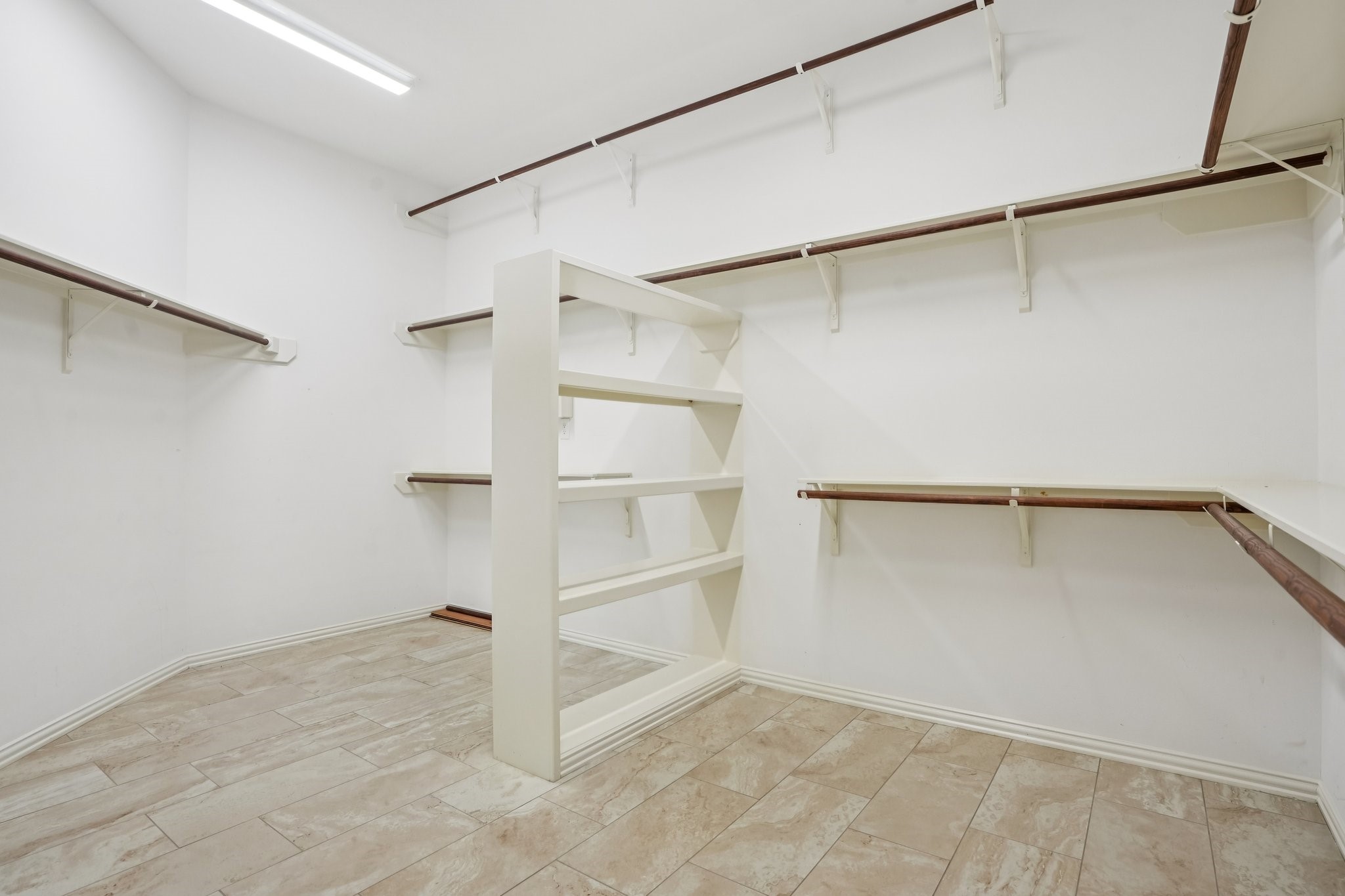 31810 Tree Farm Lane Fulshear, TX 77441 - Photo 21 of 48 a view of an empty walk in closet