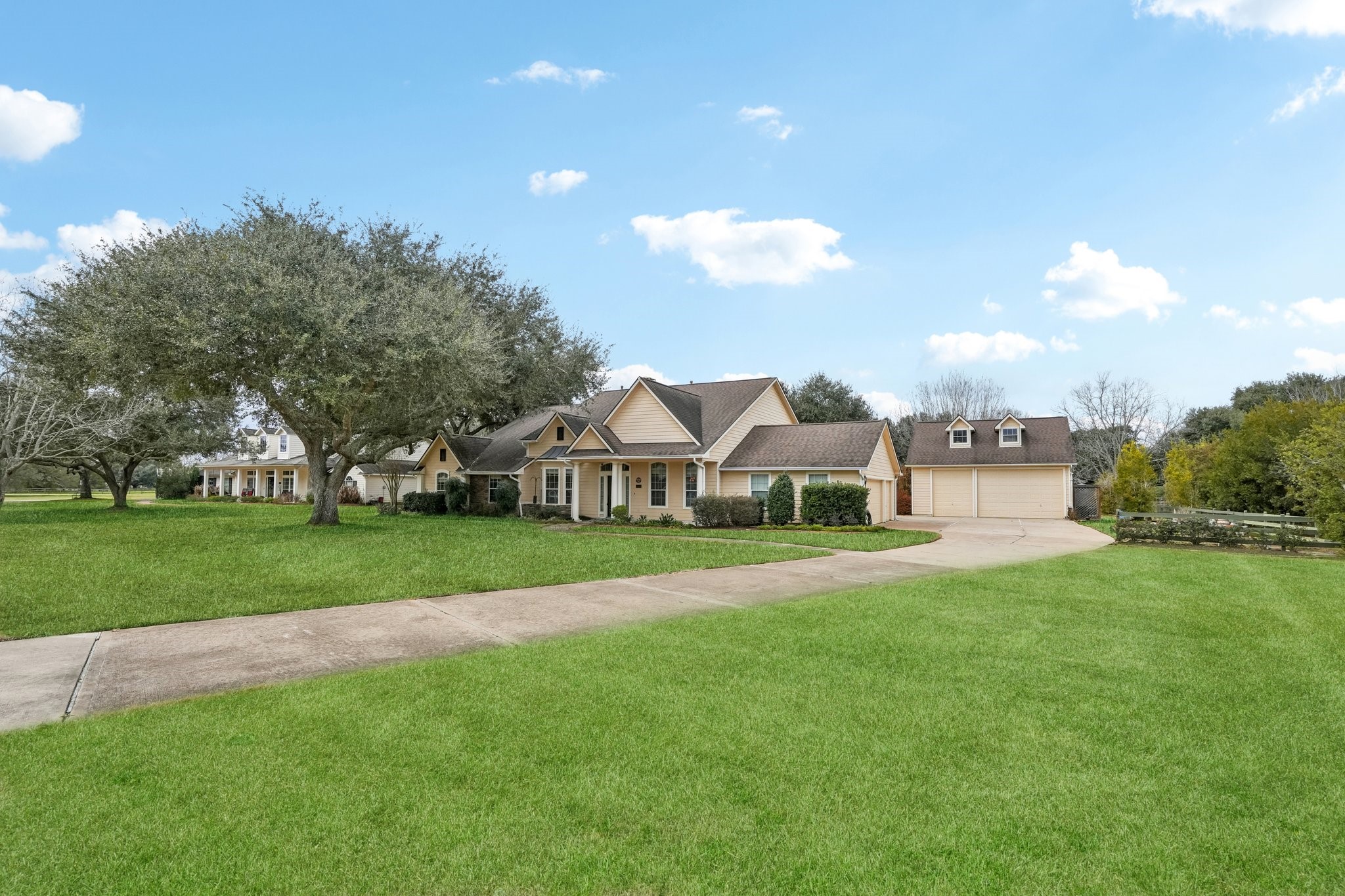 31810 Tree Farm Lane Fulshear, TX 77441 - Photo 29 of 48 a front view of a house with a yard and trees