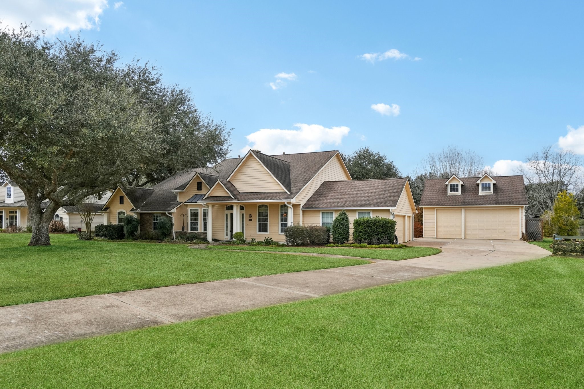 31810 Tree Farm Lane Fulshear, TX 77441 - Photo 30 of 48 a front view of a house with a yard and trees