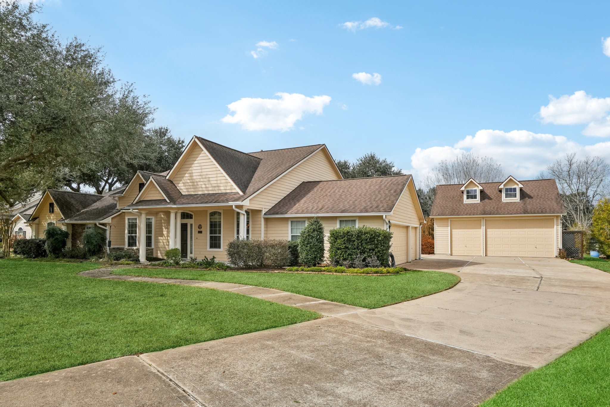 31810 Tree Farm Lane Fulshear, TX 77441 - Photo 31 of 48 a front view of a house with a yard and trees