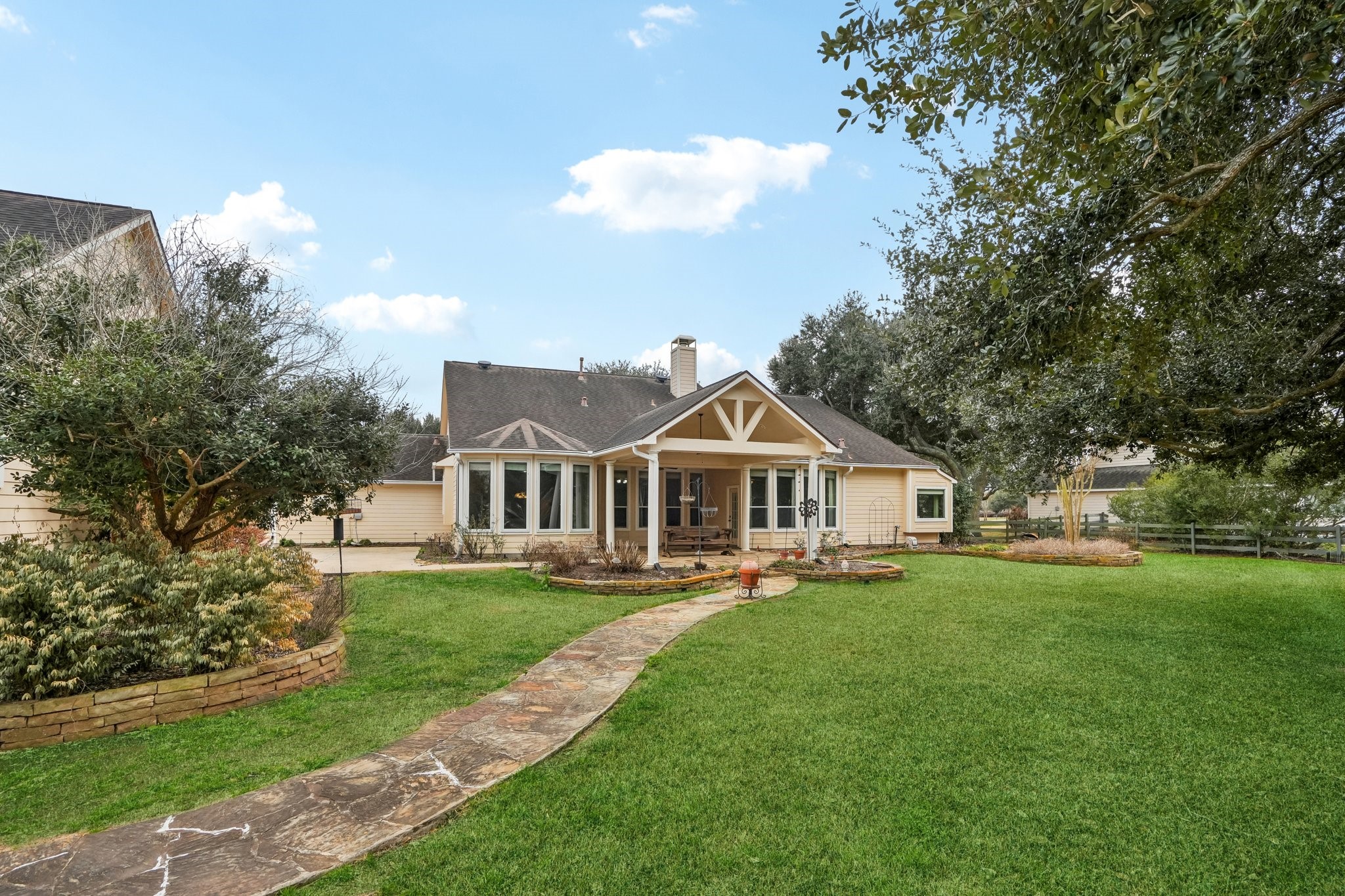 31810 Tree Farm Lane Fulshear, TX 77441 - Photo 35 of 48 a front view of a house with a yard and trees