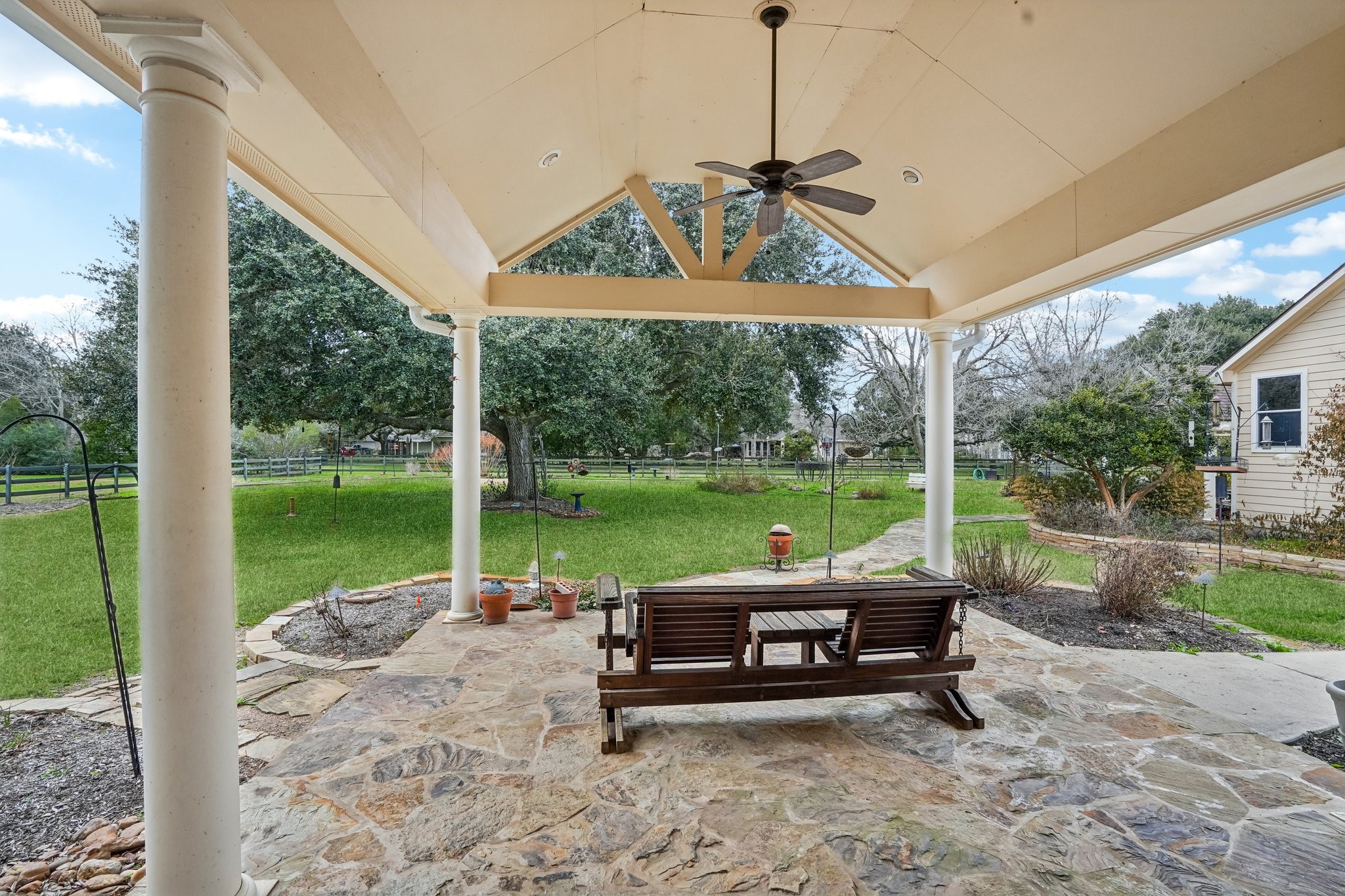 31810 Tree Farm Lane Fulshear, TX 77441 - Photo 36 of 48 a view of a patio with a table chairs and a backyard
