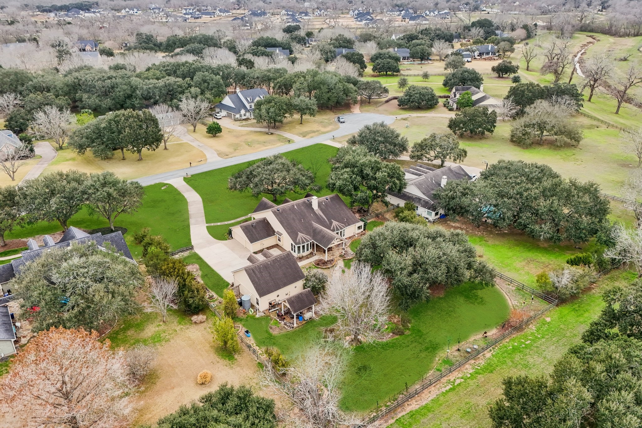 31810 Tree Farm Lane Fulshear, TX 77441 - Photo 39 of 48 an aerial view of residential house with outdoor space and lake view