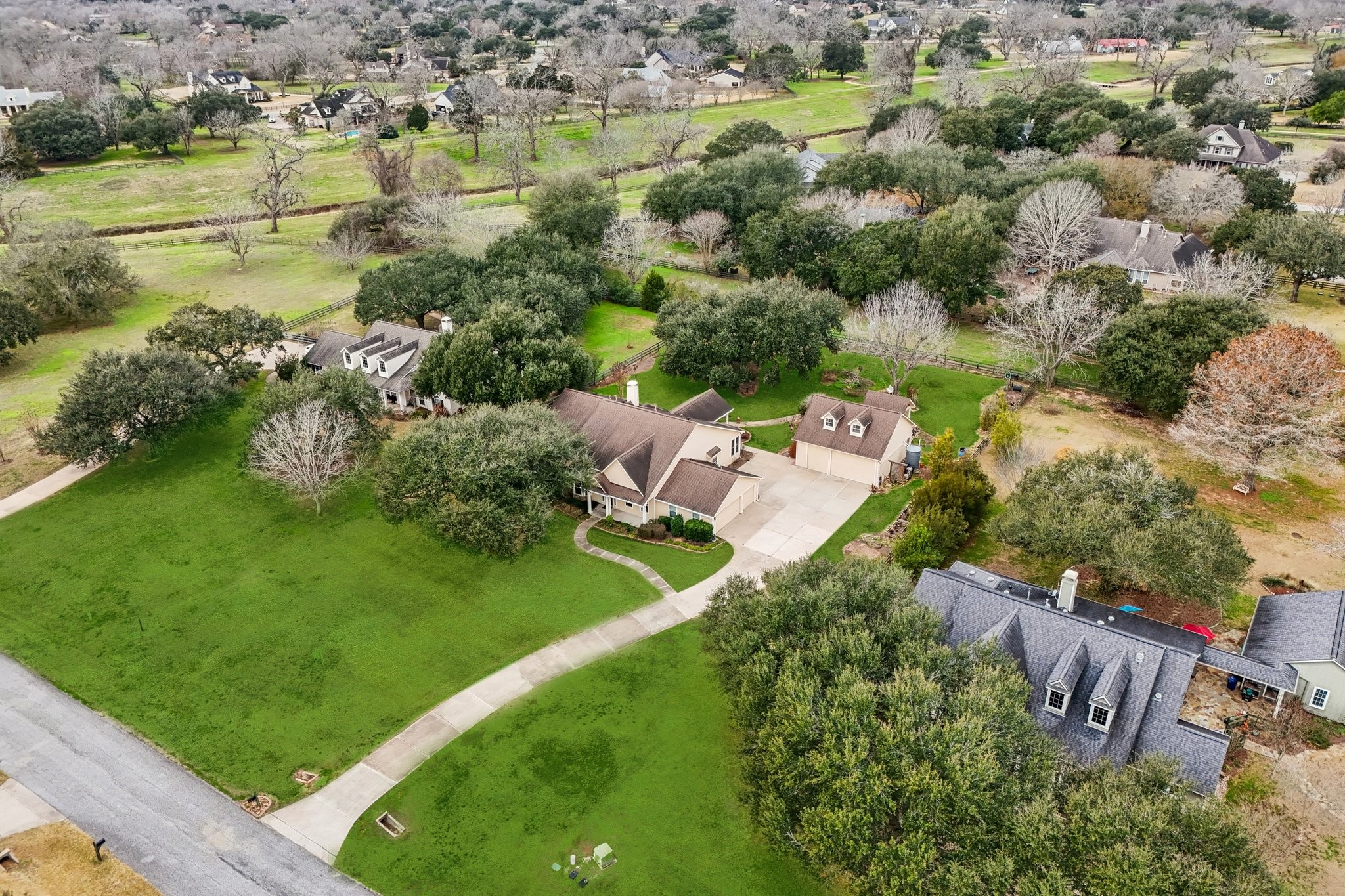 31810 Tree Farm Lane Fulshear, TX 77441 - Photo 41 of 48 an aerial view of residential houses with outdoor space and lake view