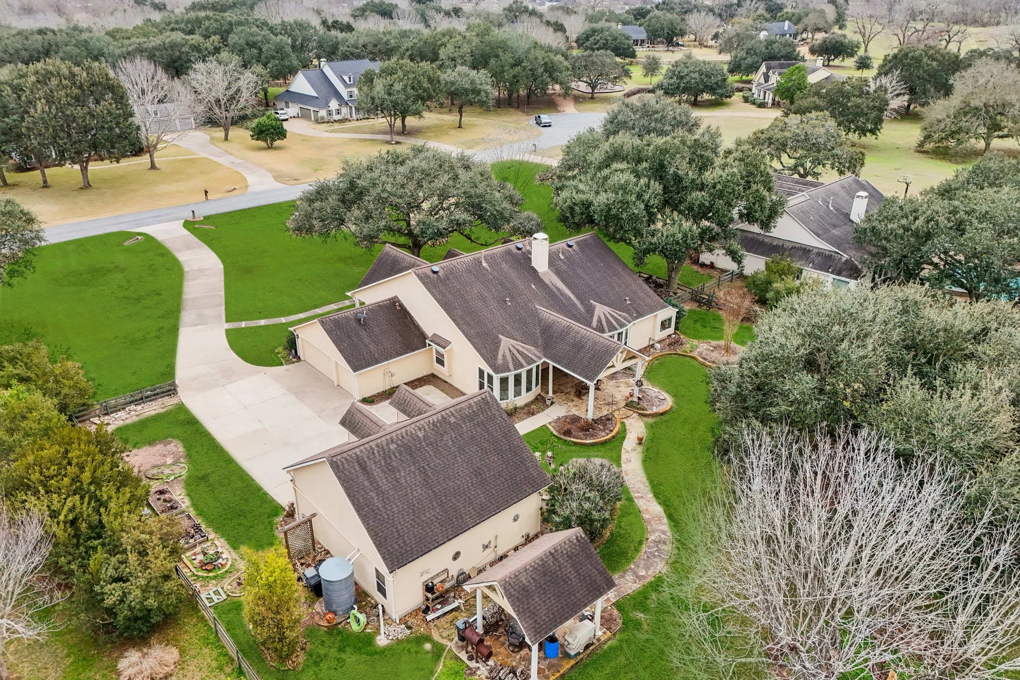 31810 Tree Farm Lane Fulshear, TX 77441 - Photo 42 of 48 an aerial view of a house with outdoor space and lake view