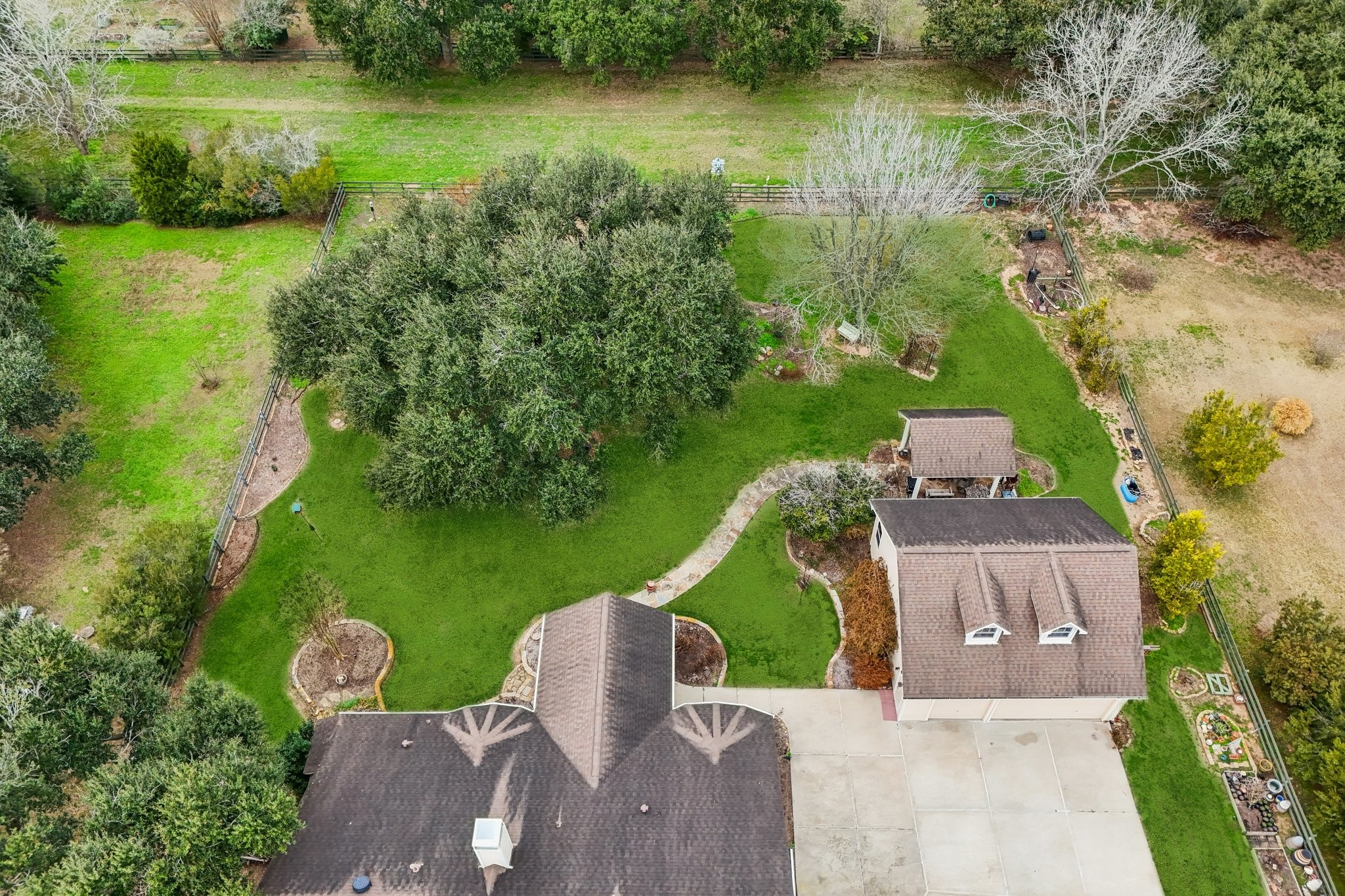 31810 Tree Farm Lane Fulshear, TX 77441 - Photo 43 of 48 an aerial view of a house with a yard and lake view
