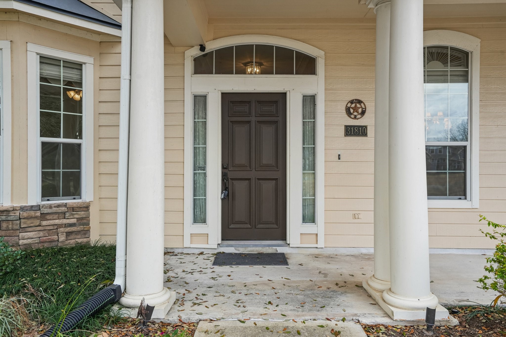 31810 Tree Farm Lane Fulshear, TX 77441 - Photo 7 of 48 a front view of a house with a yard